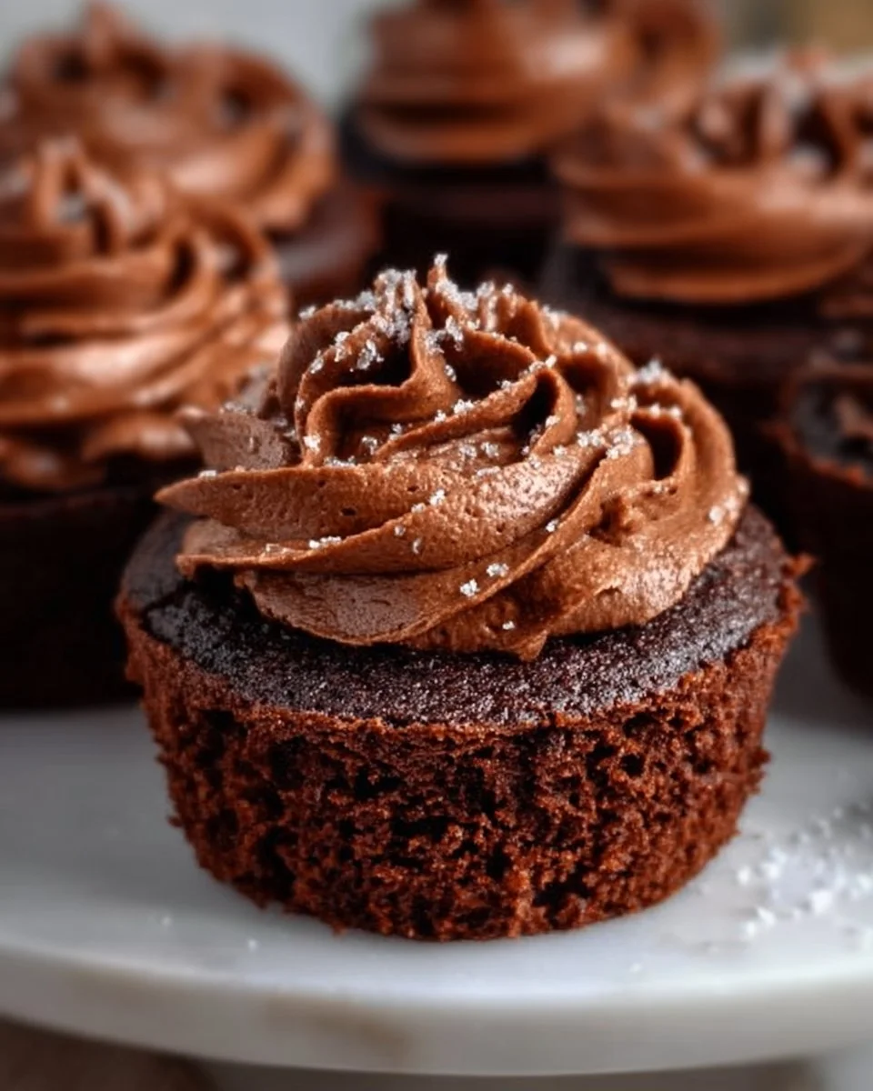 Delicious fudgy brownie cupcakes topped with chocolate frosting.