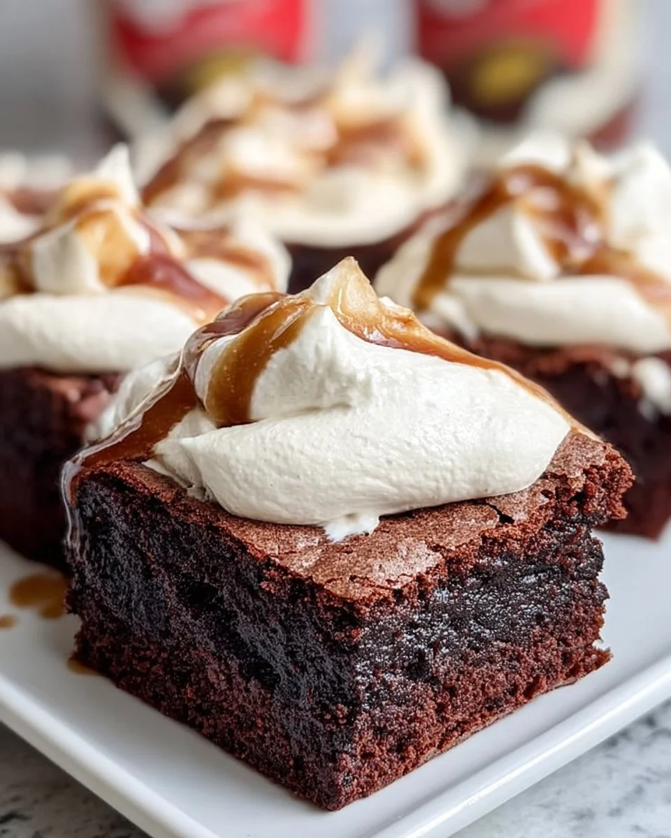 Delicious gooey root beer float brownies topped with creamy vanilla frosting.