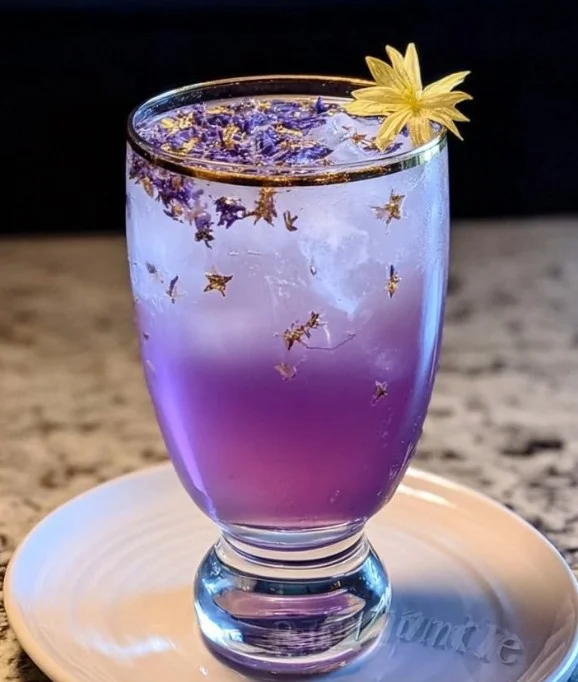 A vibrant Tinkerbell Cocktail garnished with colorful fruit, evoking a magical experience.