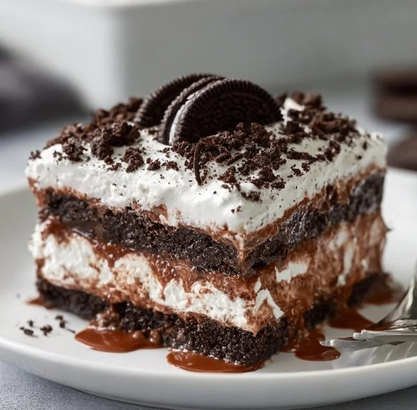 Delicious Oreo Lasagna dessert with layers of cream and chocolate cookies.