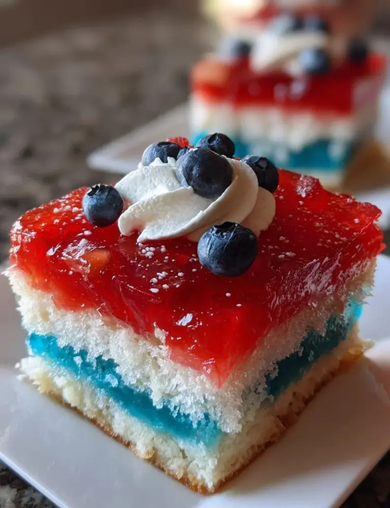 Red, White, and Blue Poke Cake decorated for a festive celebration